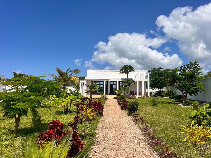 Villa exterior and garden pathway by day, Mus Home Zanzibar
